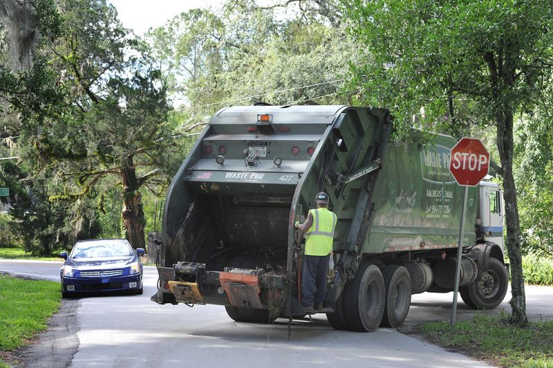 A garbage truck drives through Mandarin in this 2017 file photo.