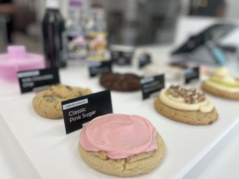 Crumbl Cookies, known for its Classic Pink Sugar cookie pictured above, is offering individual Thanksgiving pies this week and taking orders in advance.