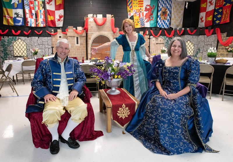 From left, principal Warren Stevens, Santa Rosa County superintendent Karen Barber, and assistant principal Kim McChesney pose in the cafeteria decorated for the banquet during the annual Medieval Festival run in collaboration with the Society for Creative Anachronism at Gulf Breeze Elementary School on Friday, March 22, 2024.