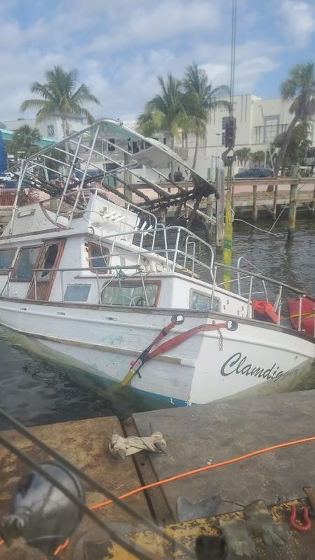 Countless boats ended up sunk in Matanzas Pass near Fort Myers Beach when Hurricane Ian hit Southwest Florida on Sept. 28, 2022. Even a year an a half later, boats like this one are still being retrieved.