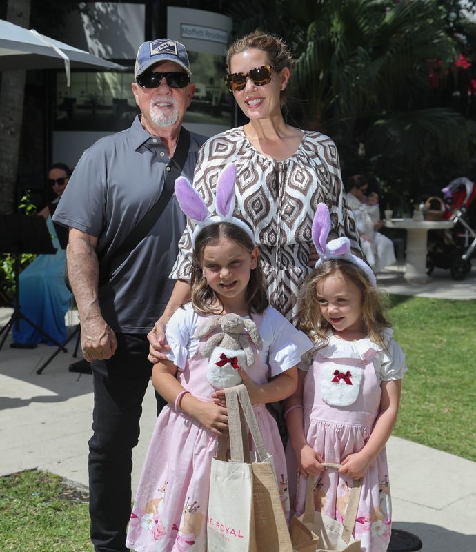Musician and singer Billy Joel poses for a photo with his family at the Royal Poinciana Plaza during the Royal Easter Affair Saturday April 16, 2022.