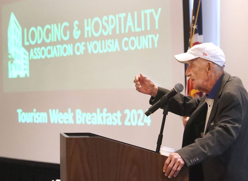 Bob Davis, president and CEO of the Lodging & Hospitality Association of Volusia County, addresses a Travel & Tourism Week celebration event in 2024 in Daytona Beach. Davis, who died on July13 at age 87, was remembered for his exceptional work ethic, compassion and energy at a funeral service on Friday, July 18.