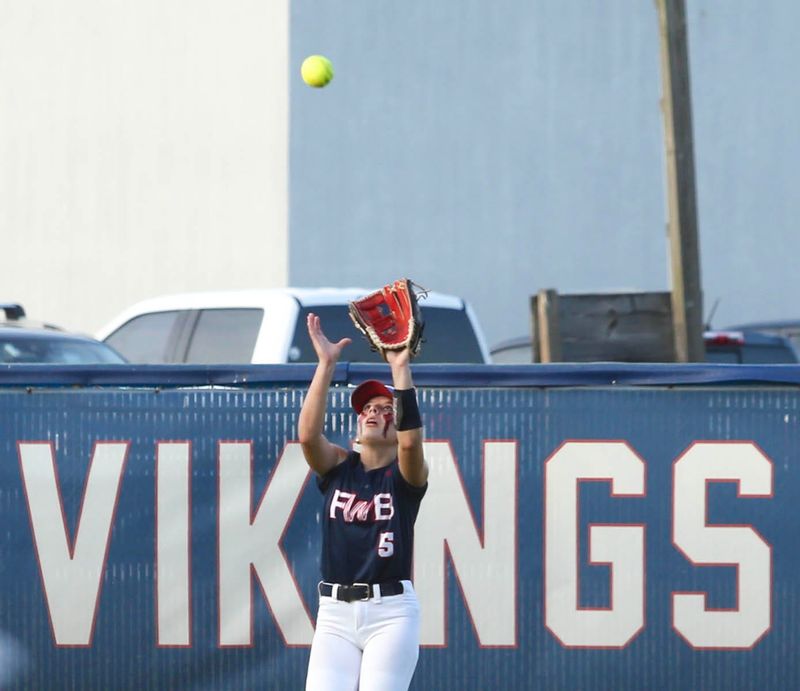 Hannah Isham reaches for a shallow pop up during the Fort Walton Beach Fleming Island girls regional quarterfinal softball game at Fort Walton Beach.The Lady Vikings won 3-1 to advance in the playoffs.