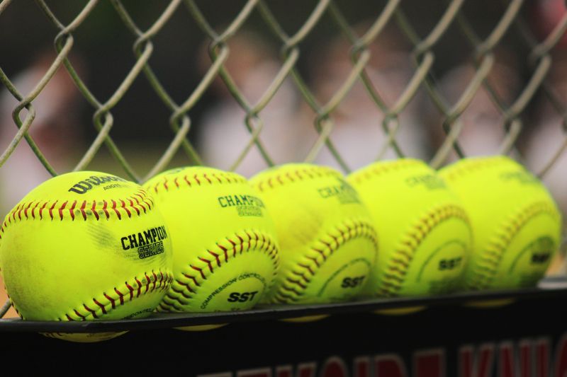 STOCK | Softballs rest on a rack in the dugout for an FHSAA Region 1-7A high school softball quarterfinal between Timber Creek and Creekside in St. Johns, Florida, on May 9, 2024. [Clayton Freeman/Florida Times-Union]