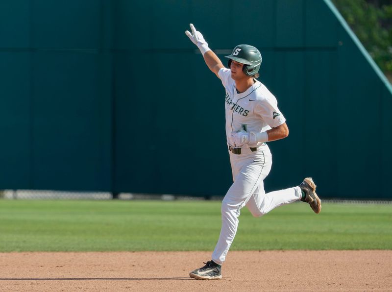 Stetson's Lorenzo Meola (1) runs the bases after hitting a solo homer during a game with Florida Gulf Coast University at Conrad Park in DeLand, Saturday, May 25, 2024.
