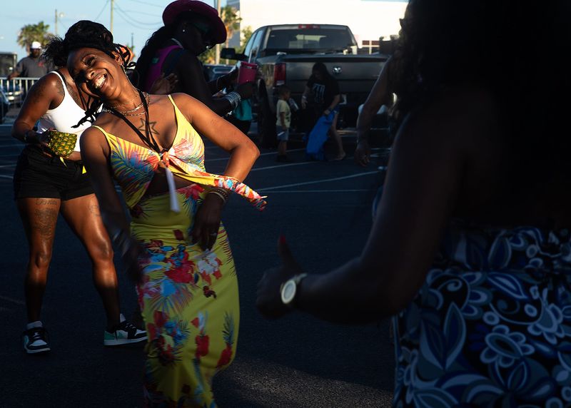 Women dance during the launching of “Groove Fest” in Panama City, Fla., June 22, 2024. The event included live music, DJ sets and local vendors. (Tyler Orsburn/News Herald)