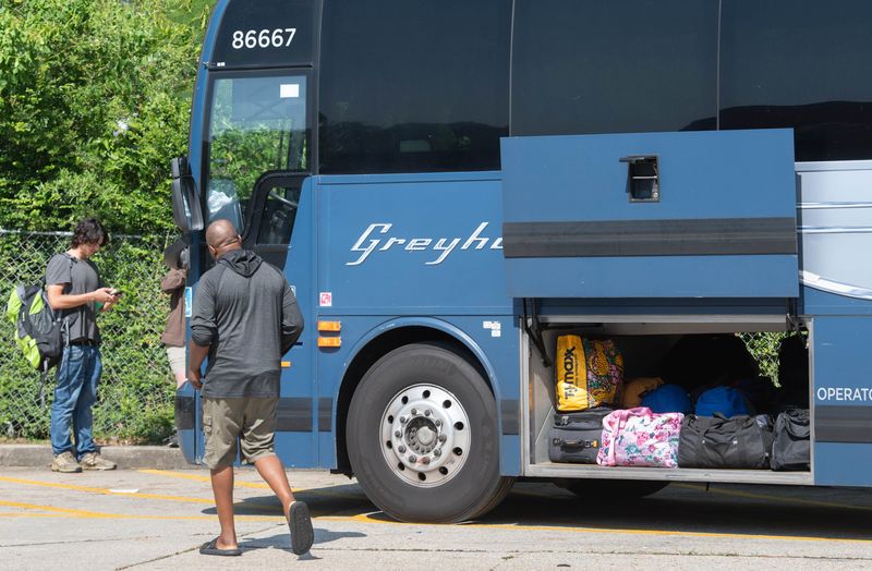 Passengers get ready to board a bus at Greyhound's new stop at the Circle K gas station at 3225 West Nine Mile Road in Pensacola on Monday, July 1, 2024.