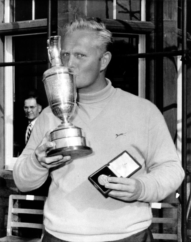 Jack Nicklaus kisses the victory cup and holds his medal after winning the 1966 British Open at Muirfield, Edinburgh, Scotland.