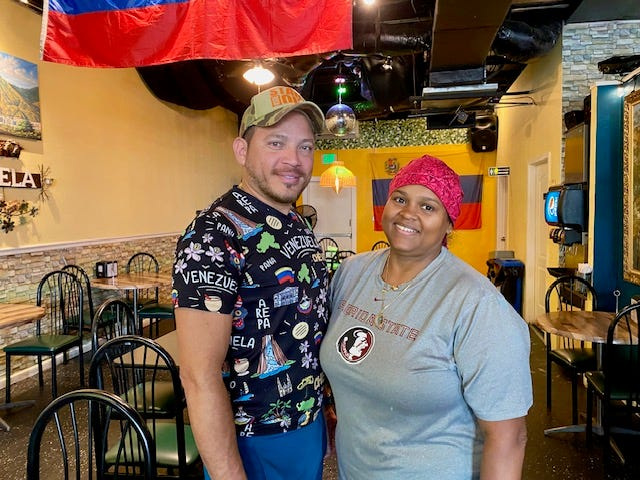 Abraham Quintero and Lida Yajure, the co-owners of VeneBites, in the restaurant’s dining room.