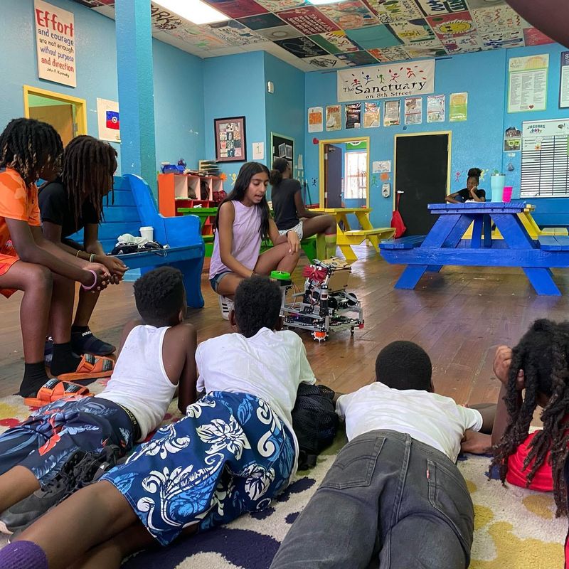 Volunteer Anjali Gusani, a student at The Bolles School, leads the robotics club at Sanctuary on 8th Street, a Jacksonville after-school nonprofit.