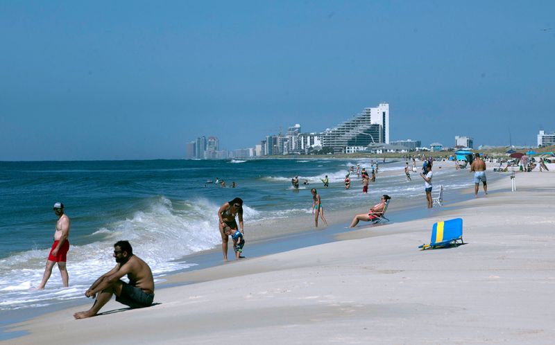 Beachgoers enjoy the surf, sun, and sand along Perdido Key Beaches on Monday, August 5, 2024. On Friday, August 2, a group of Perdido Key beachfront homeowners filed a lawsuit against Escambia County over beach access.