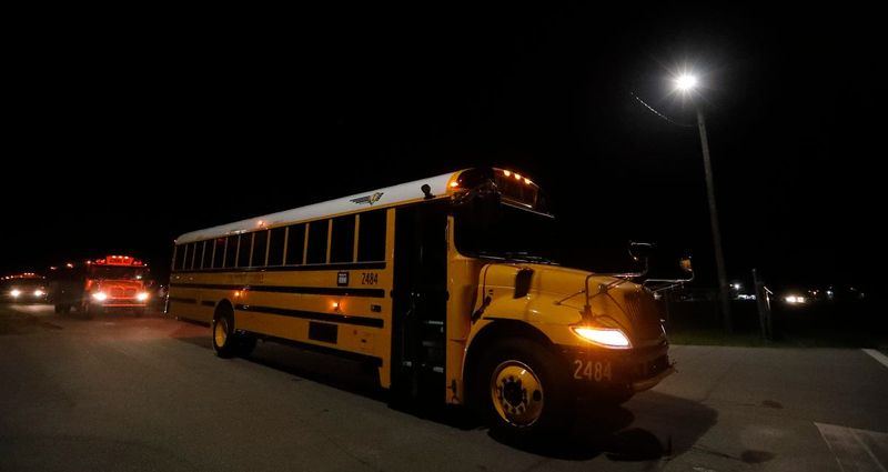 Lee County school buses depart the west zone bus compound in Cape Coral Monday morning, August 12, 2024, as the new school year began for students and teachers.