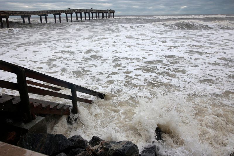 Rip tides pound the steps leading to the beach near the St. Augustine Beach Pier Friday, Sept. 30, 2022 in St. Augustine. Hurricane Ian, that was later reduced to a tropical storm, ripped through the region Thursday bringing winds, rain, flooded roads, power outages and downed trees.