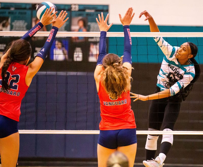 West Port Gaveena Smith (4) spikes the ball in the first set. West Port High School played Vanguard and Dunnellon played North Marion in a preseason volleyball jamboree Wednesday afternoon August 14, 2024 at West Port High School in Ocala, Fla. [Doug Engle/Ocala Star Banner]2024