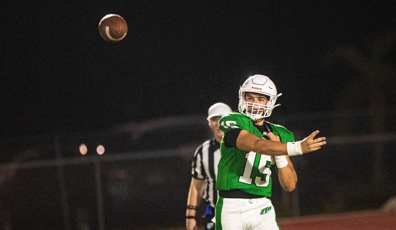 Dominic Ardezzone from Fort Myers High School throws against Estero during a jamboree game at Estero High School on Friday, Aug. 16, 2024.