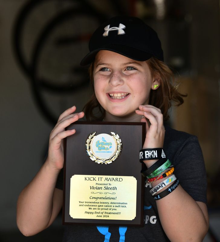 Proudly acdepting a Kick It Award from Brittanys Wish, and organization that provides financial support and others acts of kindness to Central Florida families affected by childhood cancer. Vivian Sleeth, age 9, continues her brave battle against DIPG, a rare and deadly brain-stem tumor. On Saturday, they held the 3rd Annual Lemonade Stand in front of her Rockledge home.