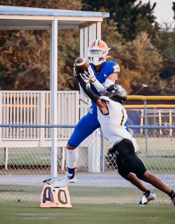 Freeport's Julius Miles makes a catch over the outstretched arms of a Rutherford defensive back in the Kickoff Classic
