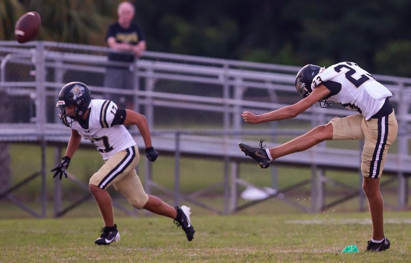 Buchholz Bobcats kicker Jay Giunta (23) kicks off to kick off the football season against Vanguard. The Vanguard Knights hosted the Buchholz Bobcats at Booster Stadium in Ocala, FL on Friday, August 23, 2024. Buchholz lead at the half 17-7. [Doug Engle/Ocala Star Banner]