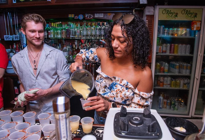 Bartender Mel Mangual competes during O'Riley's Irish Pub's Bartender Championship Sunday, August 25, 2024. The competition features 11 bartenders competing for the top prize. Each bartender makes a unique cocktail with a special ingredient, a panel of judges will determined the winners. There is also an audience favorite prize.