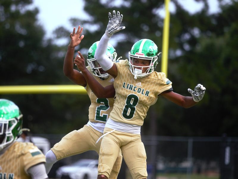 Lincoln football's Kabran Paul (#8) celebrates a touchdown in a dominate in 49-0 win over St. John Paul II at Gene Cox Stadium on Thursday, Sep. 5, 2024