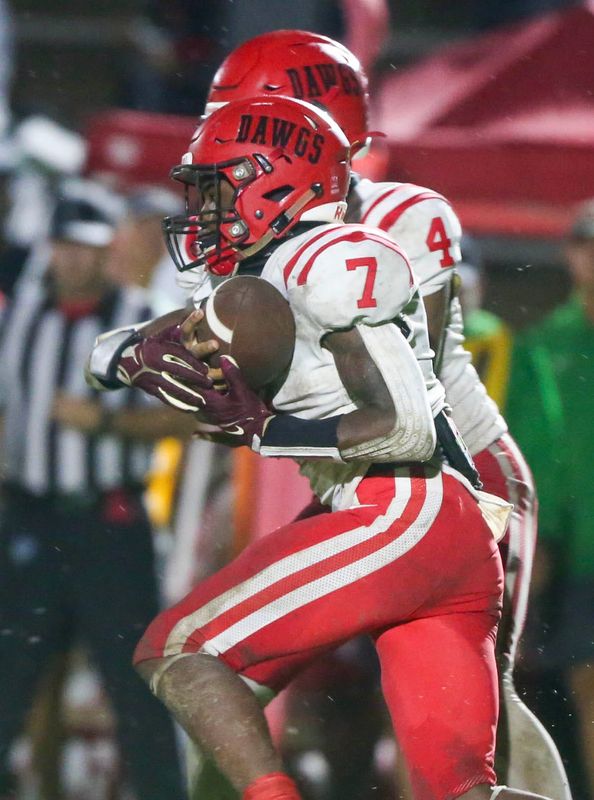 Manwell Robinson takes a handoff during the Choctaw Crestview football game at Choctaw.