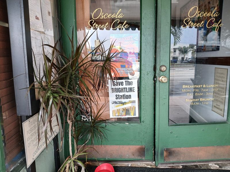 A sign in the window of Osceola Street Cafe in Downtown Stuart, Florida, Sept. 9, 2024, in support of the Brightline train station that city commissioners voted to oppose that same day.