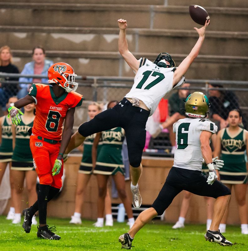 Trinity Catholic Celtics Sean Thornton (17) tries to intercept a pass intended for Eastside Rams Ja'Marian Reaves (8) in the first half. The Eastside Rams hosted the Trinity Catholic Celtics at Citizens Field in Gainesville, FL on Thursday, September 12, 2024. Eastside lead 16-0 at the half. [Doug Engle/Ocala Star Banner]