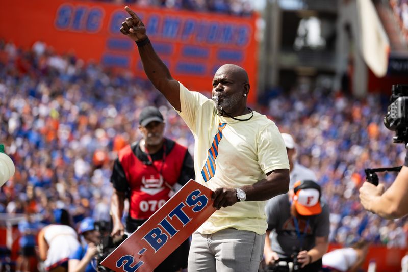 Former Dallas Cowboys and Florida Gators running back Emmitt Smith performs as honorary “Mr. Two-Bits” before a game against the Texas A&M Aggies on Sept. 14, 2024 at Ben Hill Griffin Stadium in in Gainesville, Florida. His son, EJ, players for A&M.