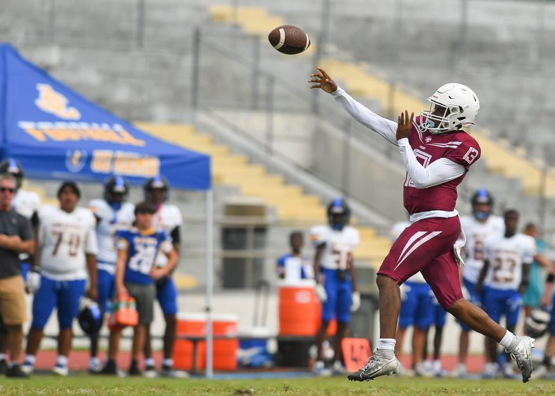 Fort Pierce Westwood quarterback EJ Weathers throws a pass against John Carroll Catholic in a high school football game Monday, Sept. 16, 2024, at Lawnwood Stadium in Fort Pierce. John Carroll Catholic won 28-22. This game was a continuation of the week one game that was stopped August 23 late in the third quarter because of a disturbance on the home side of the stands.