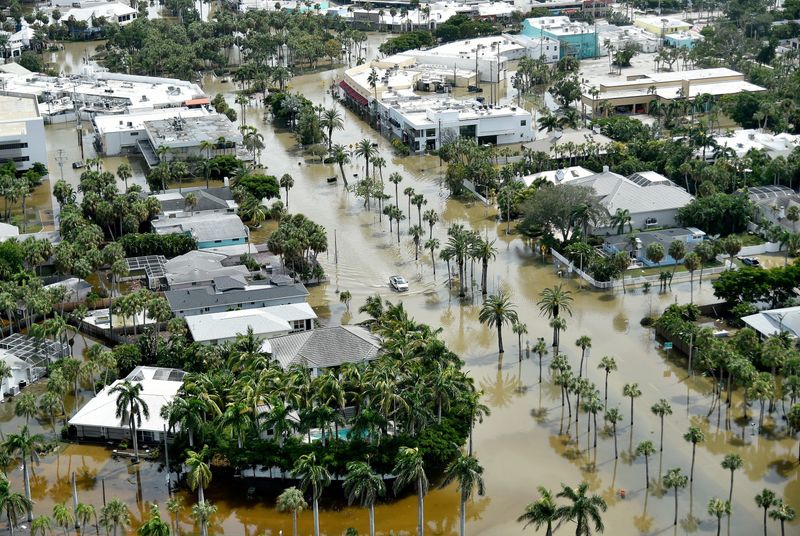 A overhead view showing the flooded streets on St. Armands Circle Friday afternoon after Hurricane Helene's storm surge. Aerial photographs of the Sarasota/Manatee barrier islands, including Longboat Key, Lido Key, and Siesta Key.