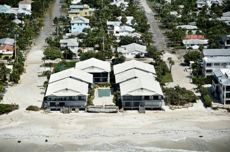 Storm surge left a big mess on Holmes Beach roads after Hurricane Helene last year.