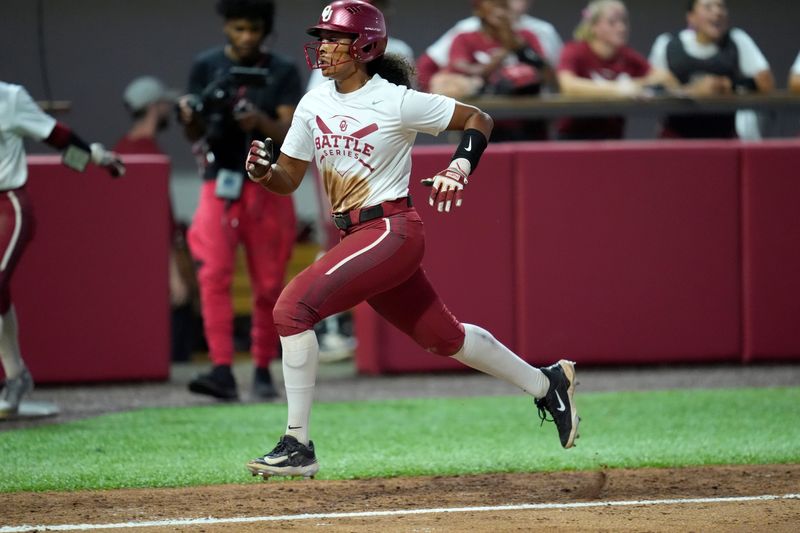Oklahoma's Tia Malloy (9) runs home to score a run during the OU softball Oklahoma Battle Series game at Love's Field in Norman, Okla., Wednesday, Oct. 2, 2024.