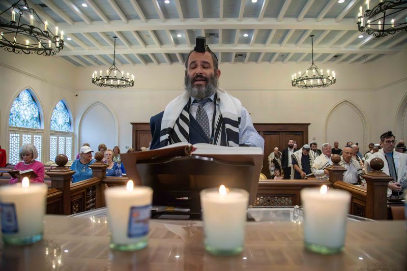 Rabbi Moshe Scheiner leads a prayer inside the Palm Beach Synagogue before an October 7 Commemoration event in October.