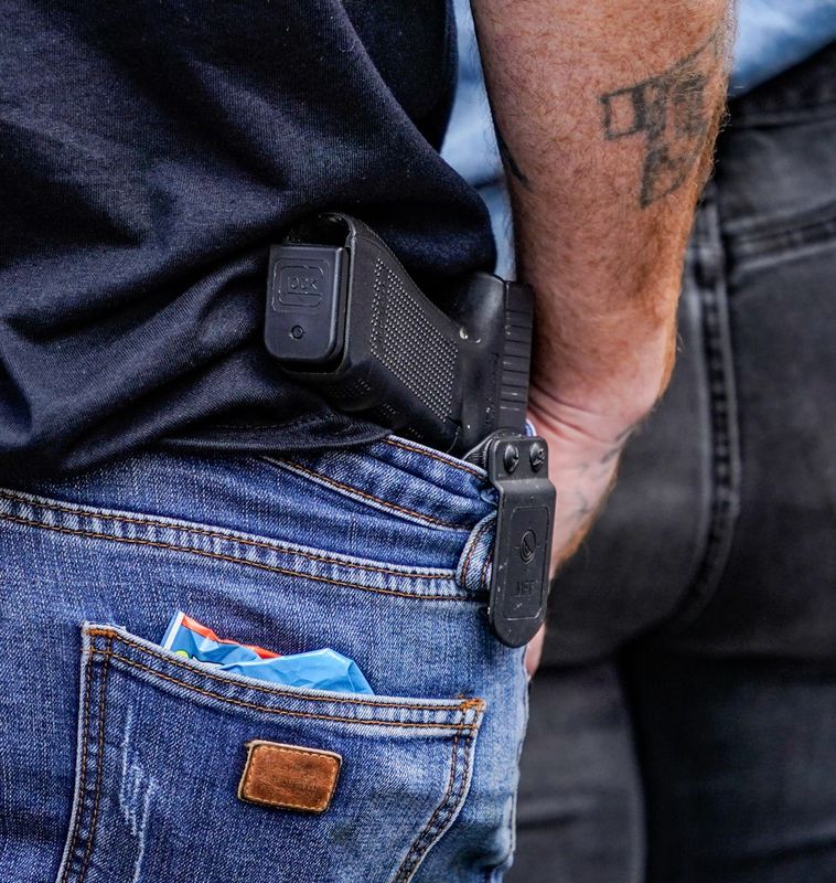 A person open carries in downtown on Saturday, Sept. 28, 2024 in Indianapolis.