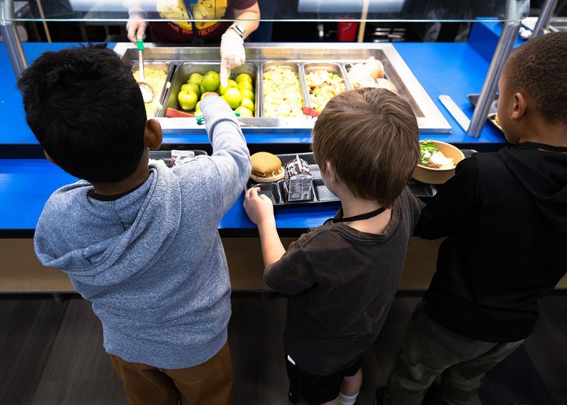 Students at Lucille Moore Elementary School in Panama City, Fla., receive lunch Oct. 15, 2024, during National School Lunch Week. (Tyler Orsburn/News Herald)