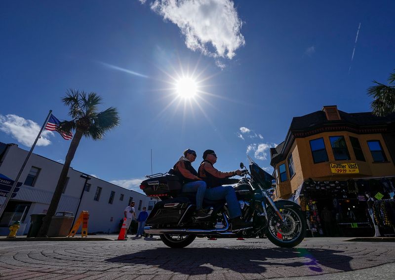 Riders cruise Main Street on the opening day of Biketoberfest 2024.