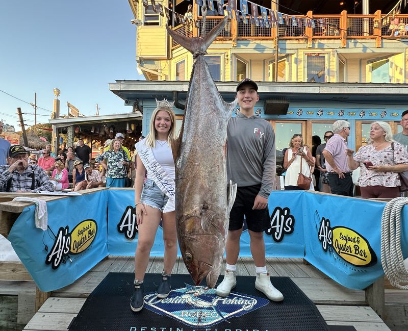 Fisher Parker, 13, shows off his 89.8-pound amberjack caught aboard the 100 Proof with Capt. Allen Staples. His catch is in first place in the Junior Division of the Destin Fishing Rodeo.