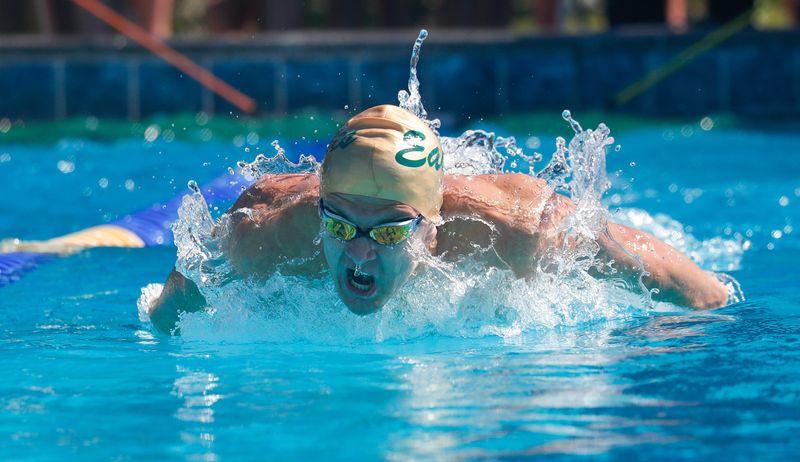 George Jenkins' Dylan Cardosi competes in the 100 butterfly on Friday at the Class 4A, District 7 meet at Gandy Pool.