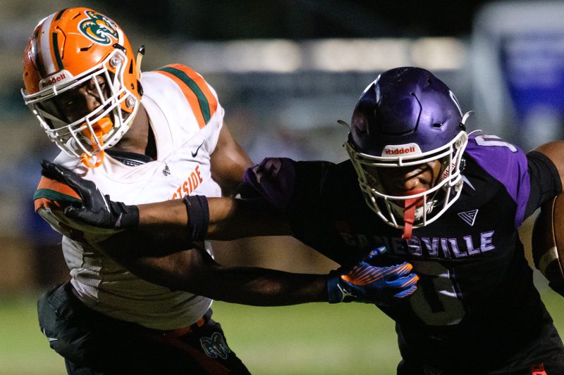 Hurricanes Devin Johnson (0) stiff arms Eastside Rams Kamariyon Mack (3) during the first half between Eastside High School and Gainesville High School at Citizens Field in Gainesville, FL on Friday, November 1, 2024. [Chris Watkins/Gainesville Sun]
