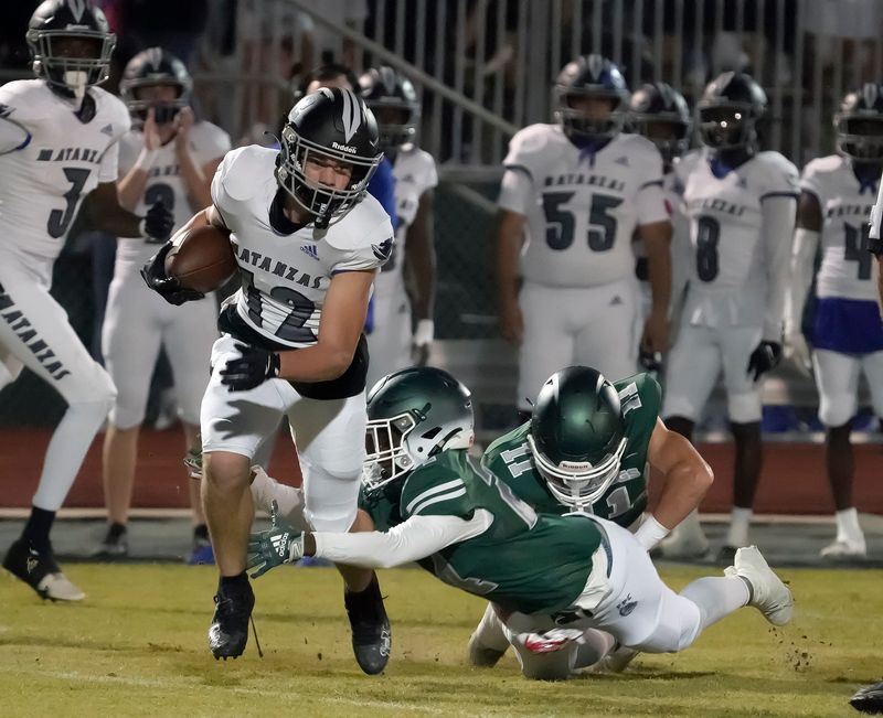 Matanzas' Jordan Schendorf attempts to break a tackle during a game with Flagler Palm Coast at FPC High School, Friday, Nov. 1, 2024.