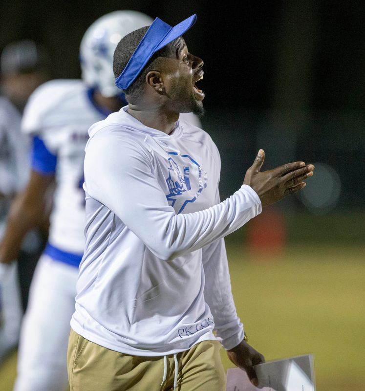 Pahokee head coach Carlos Lammons Jr. yells instructions to his players against Glades Central during the Muck Bowl on November 1, 2024, in Belle Glade, Florida.