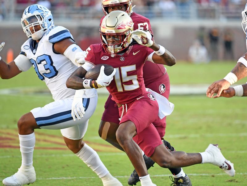 Nov 2, 2024; Tallahassee, Florida; Florida State Seminoles receiver Lawayne McCoy (15) runs the ball for a two-point conversion against North Carolina in the first quarter at Doak S. Campbell Stadium.