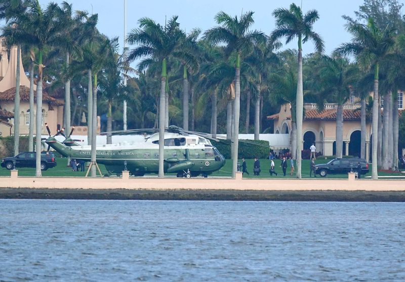 Two Marine One helicopters sit on the helipad at Mar-a-Lago in Palm Beach Monday, February 18, 2019.
