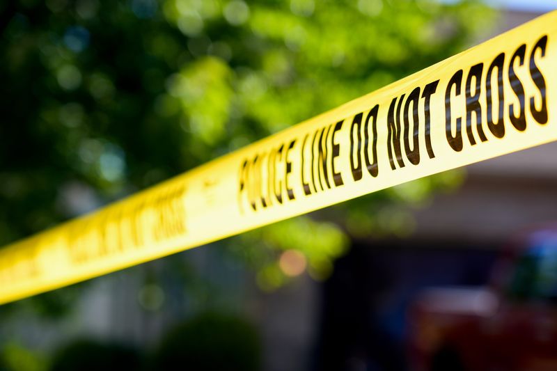 Police tape off a crime scene.