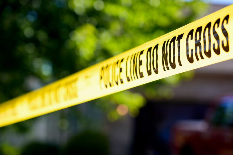 Police tape off a crime scene.