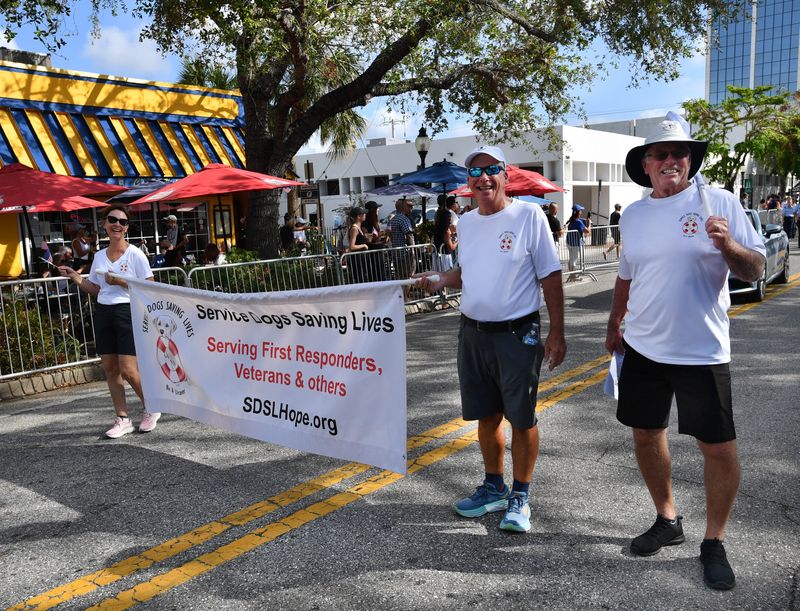 Members of Service Dogs Saving Lives march in the parade. The City of Sarasota and the Sarasota Patriotic Observance Committee hosted the annual Veterans Day Parade on Monday on Main St. in downtown Sarasota. The parade included marching bands, color guards, first responders, law enforcement agencies, veterans groups and community organizations.