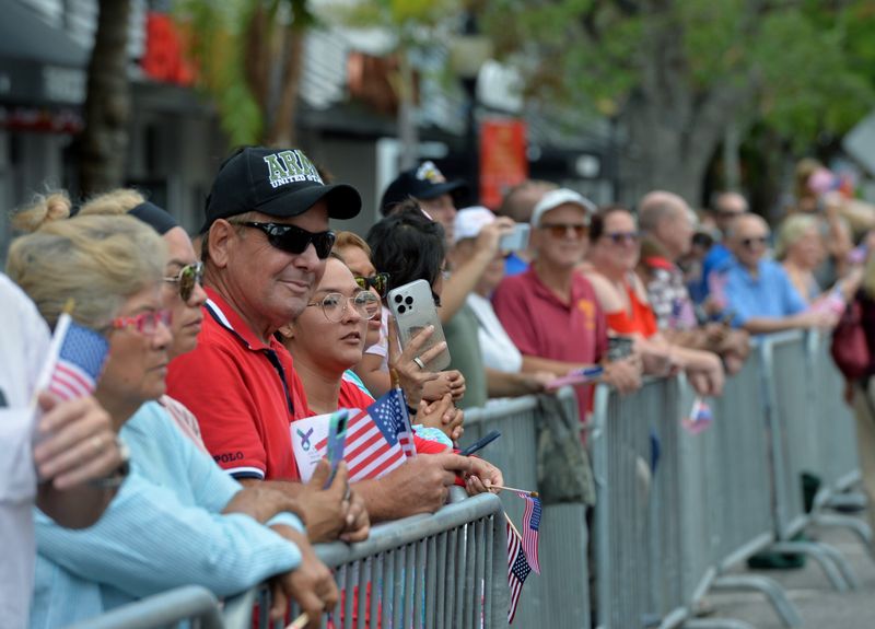 Parade watchers enjoy the show. The City of Sarasota and the Sarasota Patriotic Observance Committee hosted the annual Veterans Day Parade on Monday on Main St. in downtown Sarasota. The parade included marching bands, color guards, first responders, law enforcement agencies, veterans groups and community organizations.