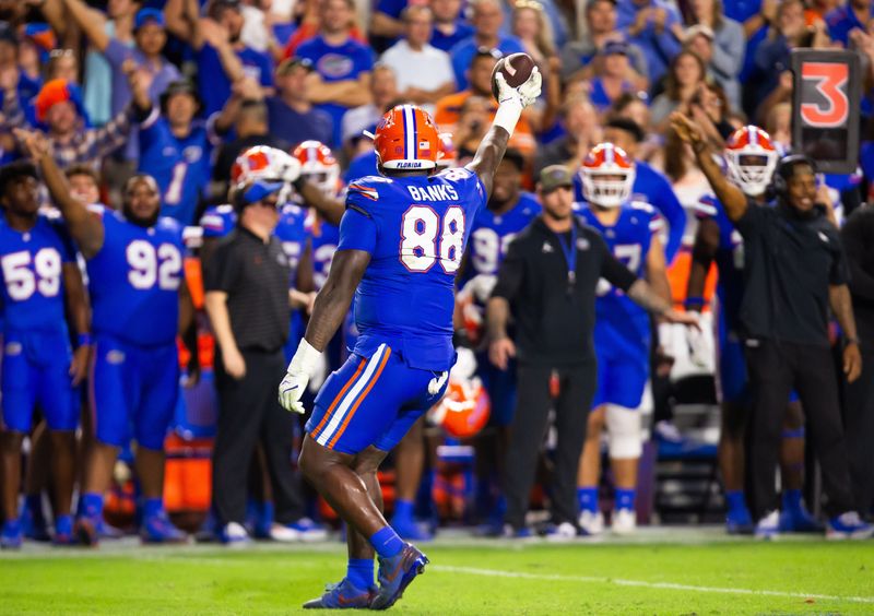 Florida Gators defensive lineman Caleb Banks (88) comes up the fumble during the second half at Ben Hill Griffin Stadium in Gainesville, FL on Saturday, November 16, 2024. The Gators defeated the Tigers 27-16. [Doug Engle/Gainesville Sun]