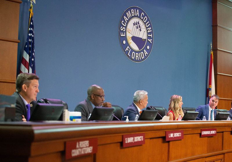 From left, Steven Barry, Lumon May, Steven Stroberger, and Ashlee Hofberger listen as then Chair Mike Kohler speaks during the installation ceremony of Escambia Board of County Commissioners in downtown Pensacola on Tuesday, Nov. 19, 2024. A lawsuit filed against the clerk over discretionary spending may want to add board as plaintiff.