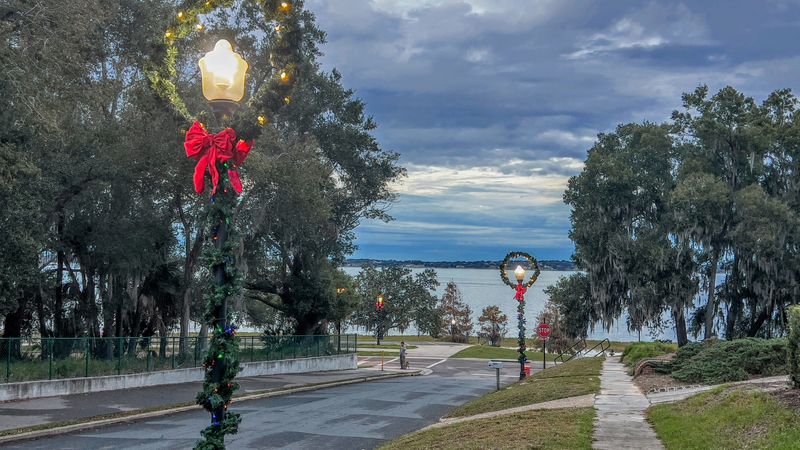 Clermont's downtown historic district and the sidewalks near Lake Minneola are decorated with holiday lighting and wreaths during the Christmas season.